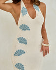 Ana Maxi dress in off white knit, three quarter front view with pearl bead detailing and hand crochet shells, maxi length fringing 